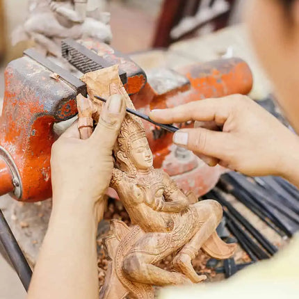 Traditional wooden sculpture carving at Artisans Angkor