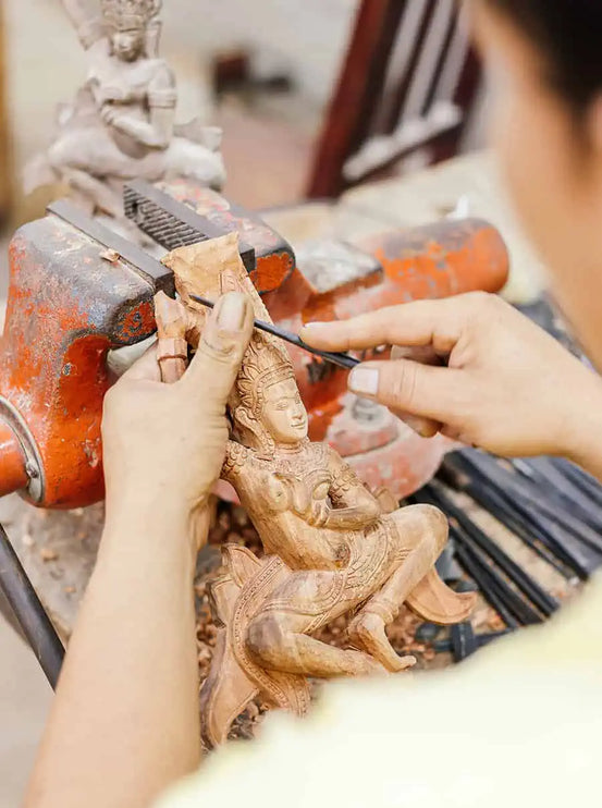 Traditional wooden sculpture carving at Artisans Angkor